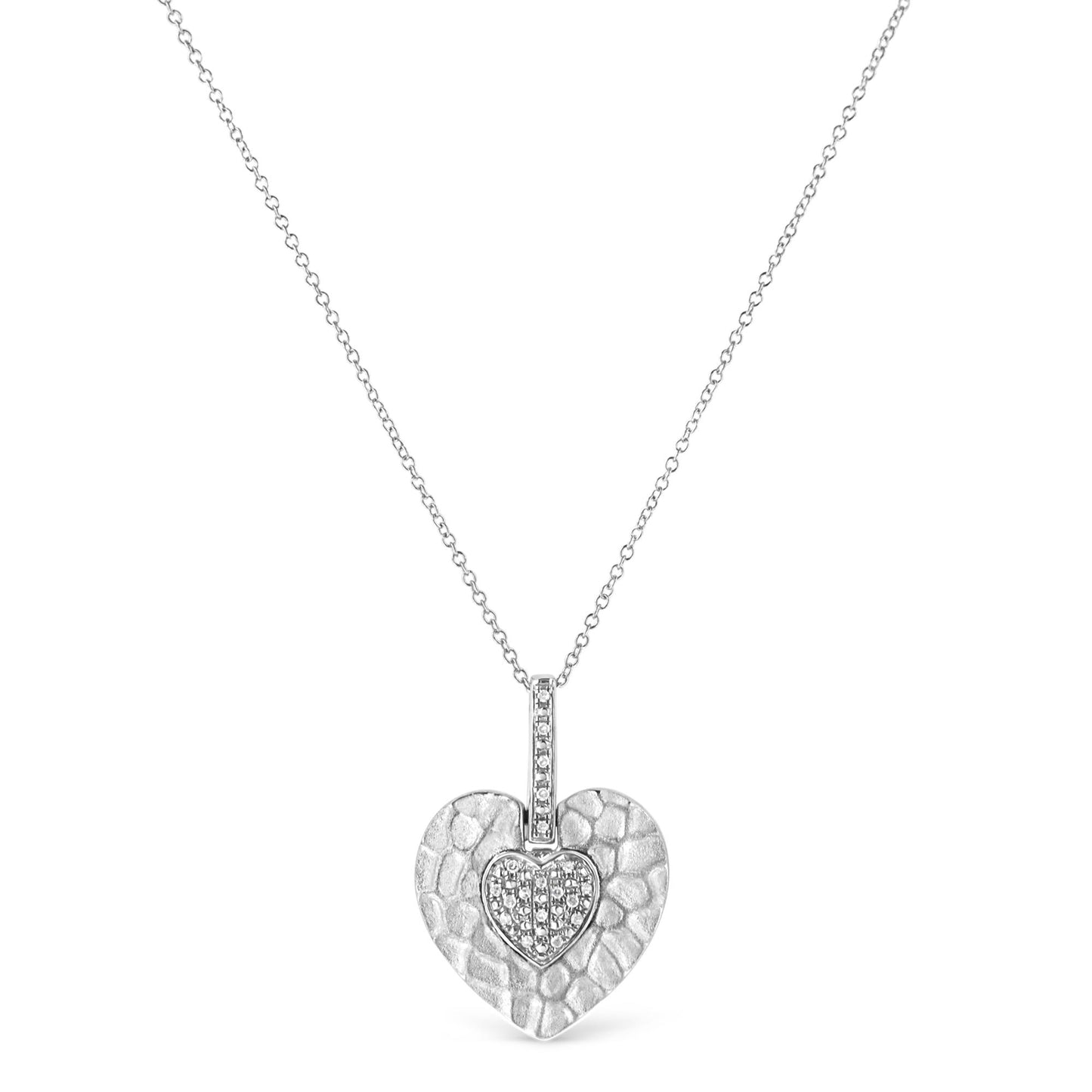 White metal necklace with a textured heart-shaped pendant featuring a smaller heart inset with pave-set round white gemstones, shown in a front-facing view.