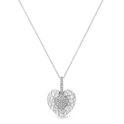 White metal necklace with a textured heart-shaped pendant featuring a smaller heart inset with pave-set round white gemstones, shown in a front-facing view.