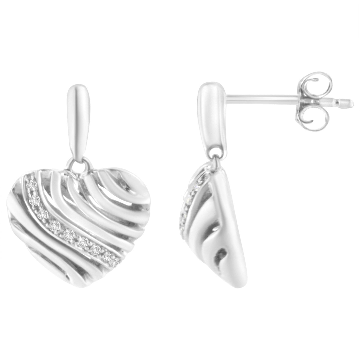 Front and side view of white metal heart-shaped earrings with diagonal textured lines and a row of white gemstones in a pave setting.