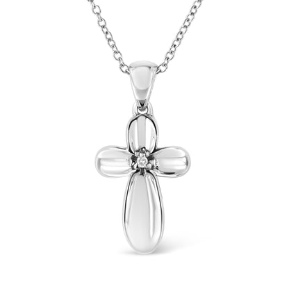 Front view of a white metal cross-shaped necklace pendant with a round white gemstone in prong setting at the center, hanging from a chain.