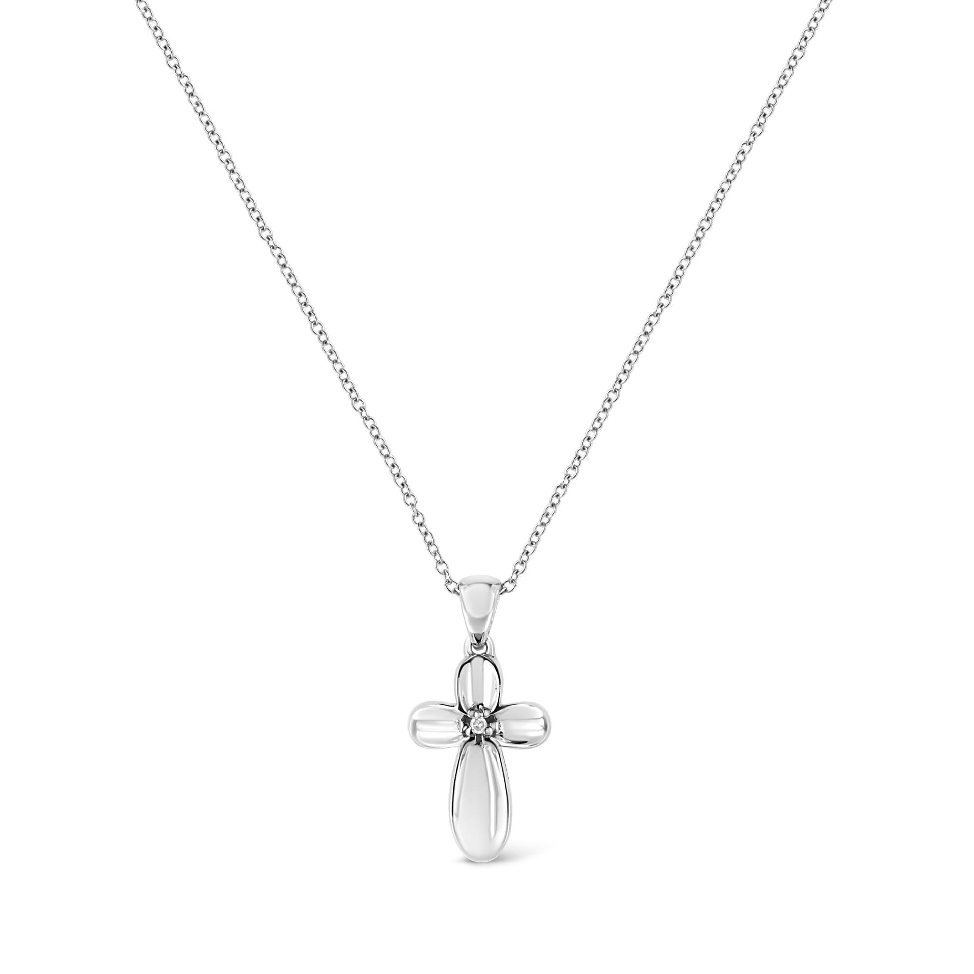 White metal necklace with a cross-shaped pendant featuring a single round white gemstone in prong setting, shown in a front-facing view.