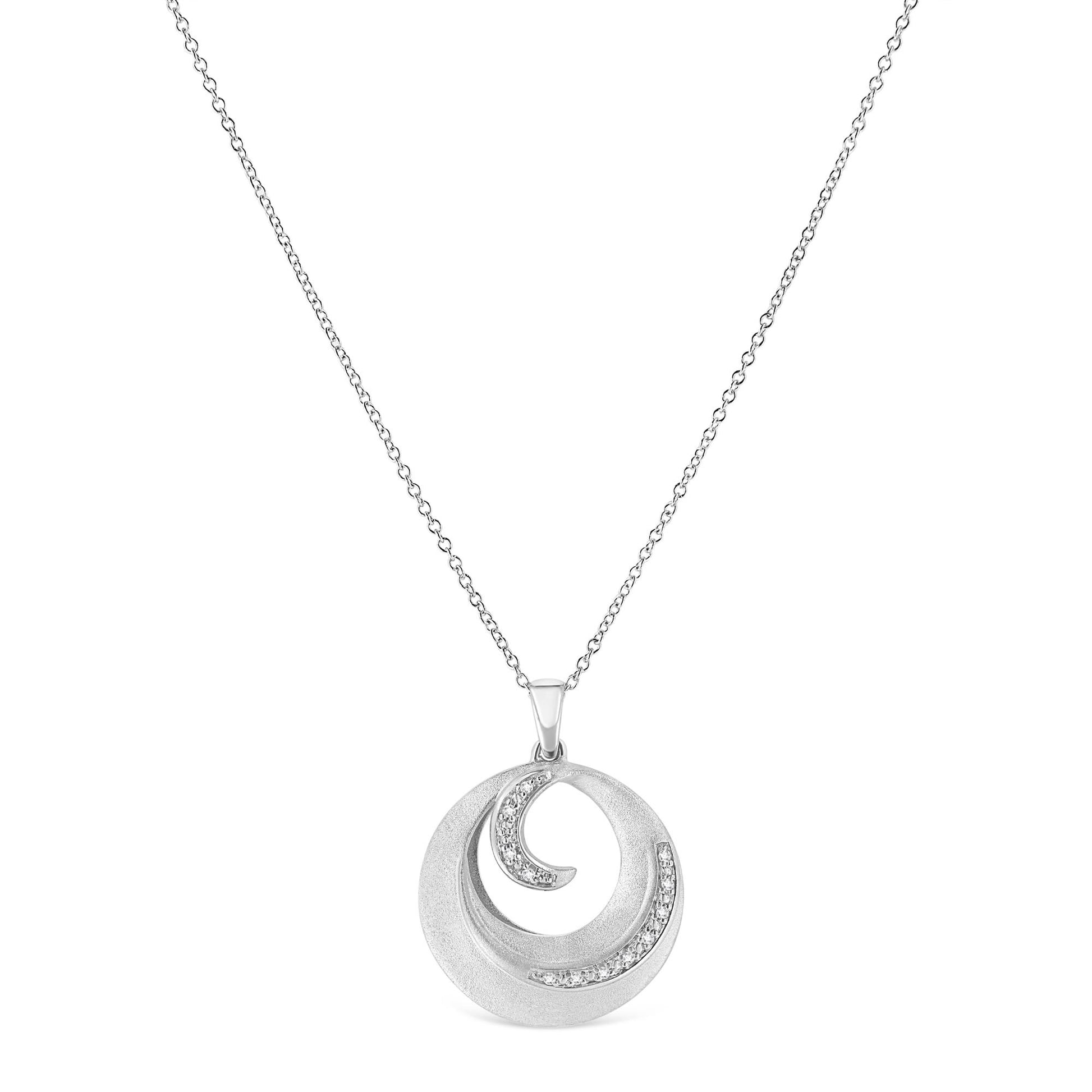 Front-facing view of a white metal necklace with a circular pendant featuring a swirl design accented with white round pave-set gemstones.