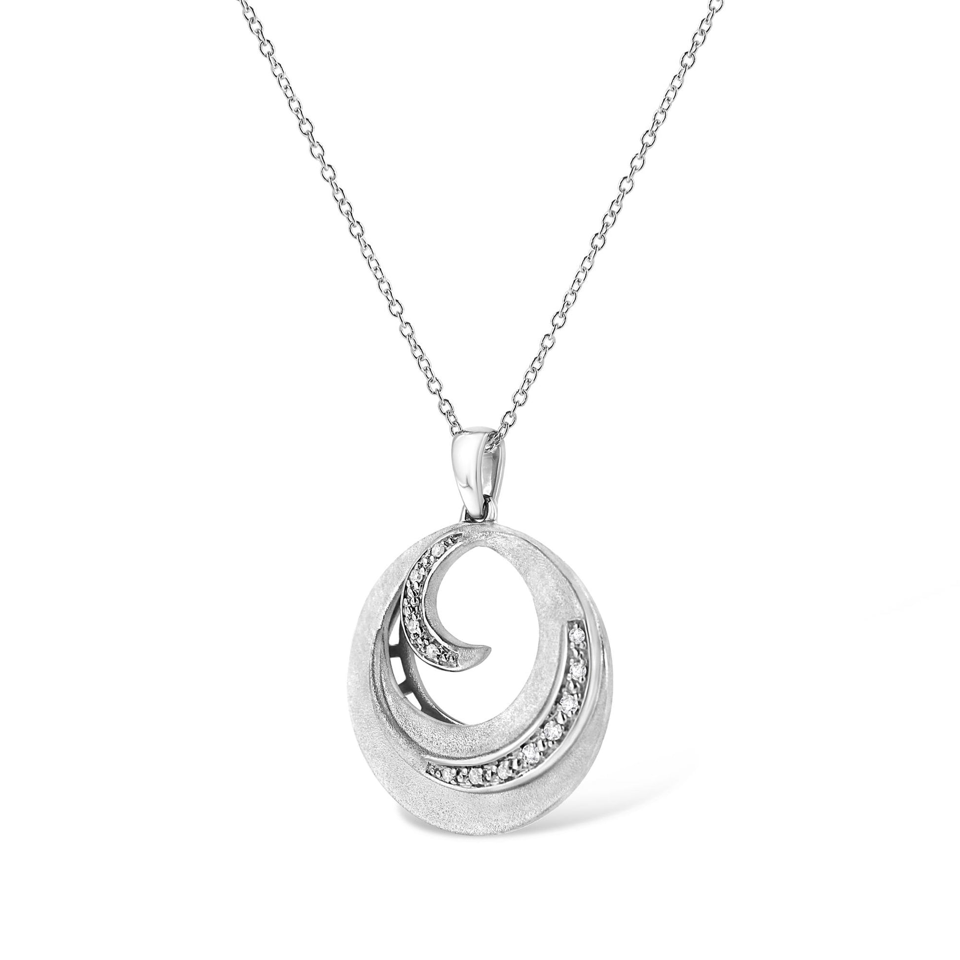 White metal necklace with a circular pendant featuring two curved sections set with white round pave gemstones, shown in a front-facing angle.