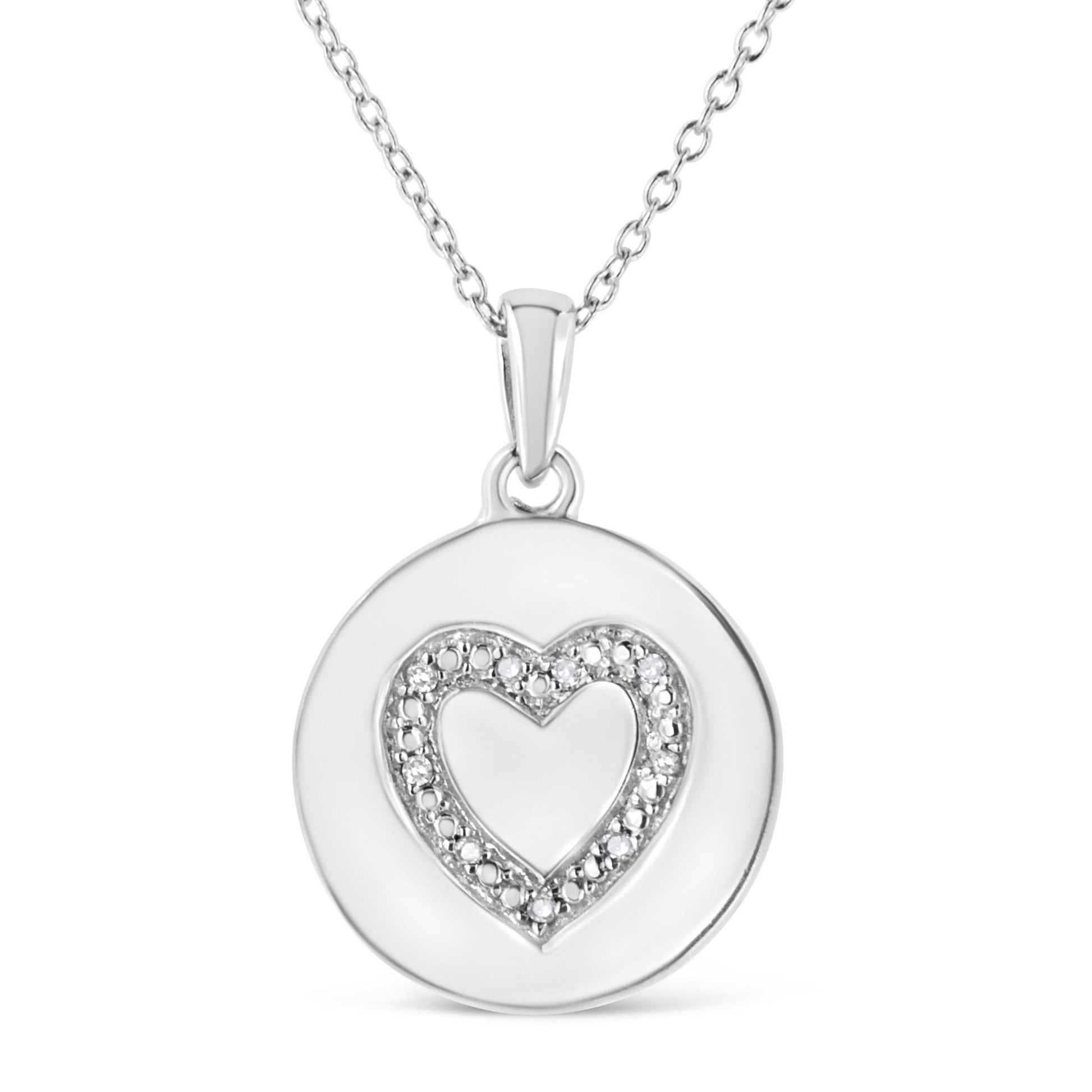 Front view of a white metal round pendant necklace with a heart-shaped outline of white gemstones in prong settings on a chain.