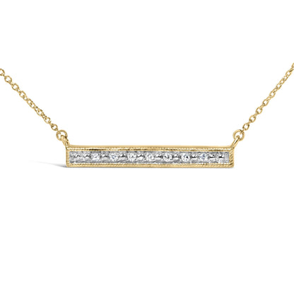 Close-up front angle of a yellow metal necklace with a horizontal rectangular bar pendant set with round white gemstones in prong settings.