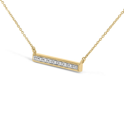 Close-up front angle of a yellow metal bar necklace with seven white gemstones in a row, shown on a white background.