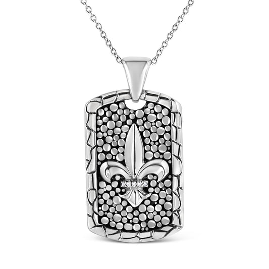 Front view of a white metal necklace with a rectangular pendant featuring a textured background, a fleur-de-lis design in the center, and a row of round white gemstones in an invisible setting across the fleur-de-lis.