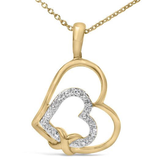 Close-up front view of a yellow necklace pendant with interlocking open heart shapes, one outlined with white gemstones in a pave setting.