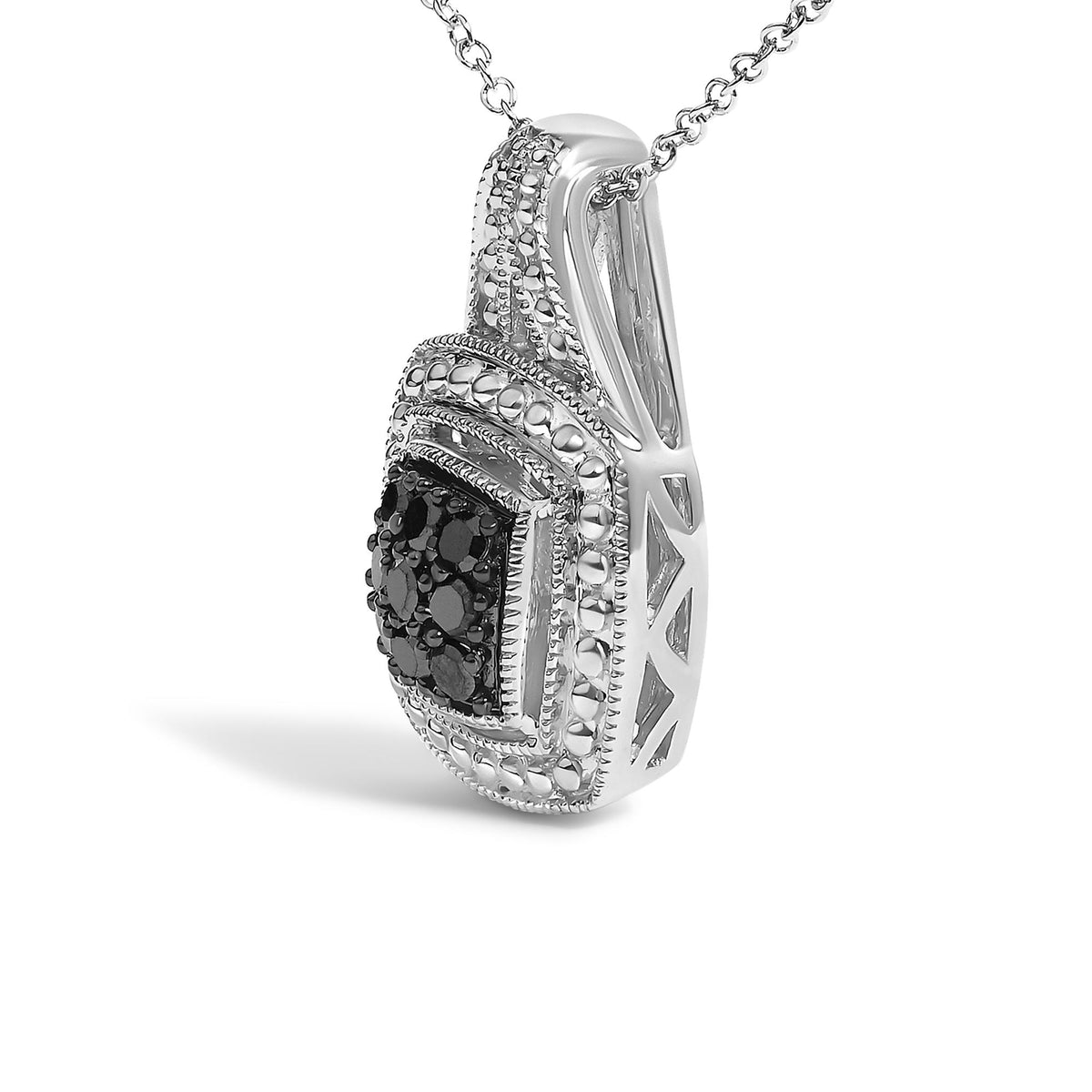 Close-up front angle of a white metal necklace pendant adorned with round black gemstones in a pave setting and detailed metalwork.