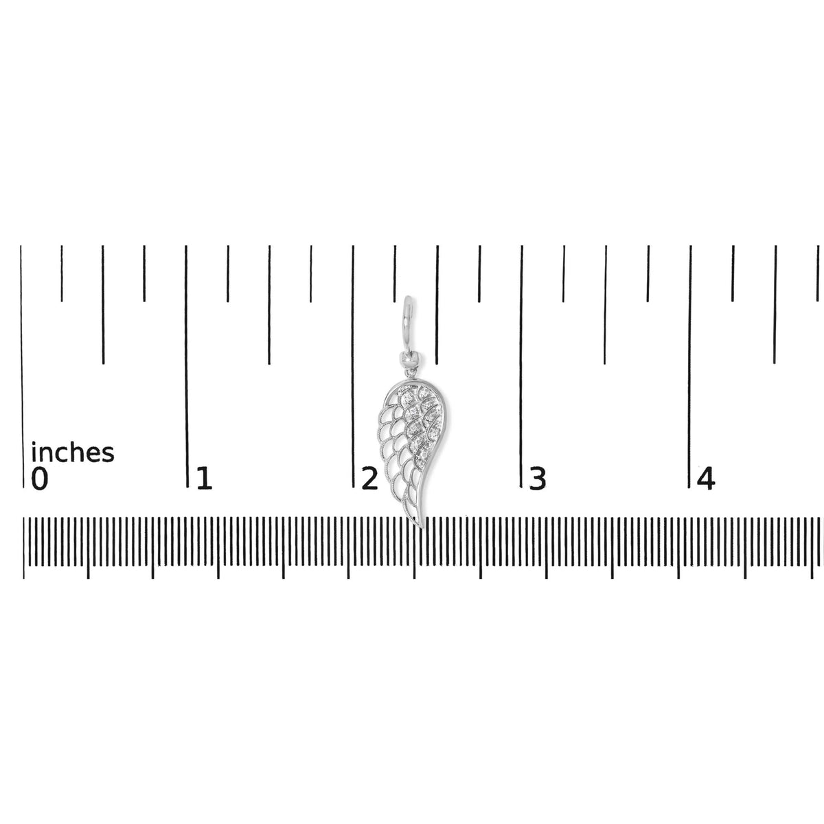 Close-up front view of a single white metal earring shaped like an elongated wing with pavé-set round white gemstones, shown on a measurement scale.