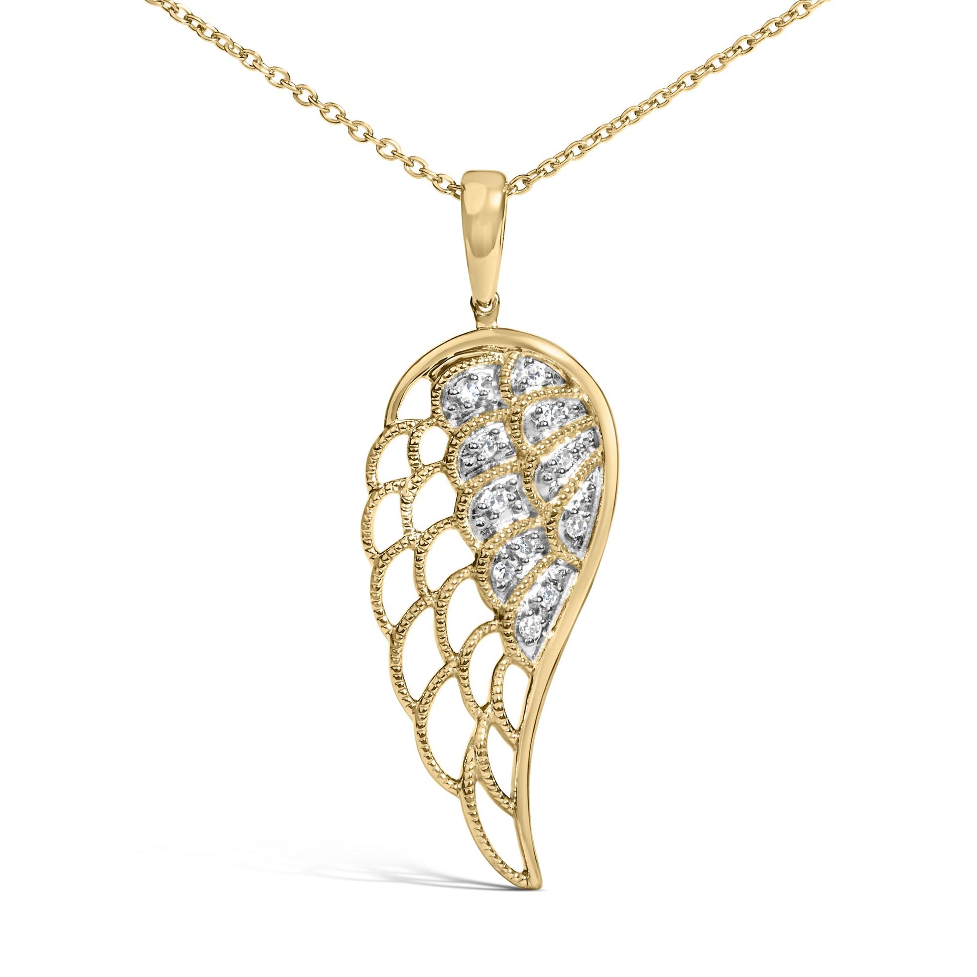 Close-up front view of a yellow metal necklace with an asymmetrical wing-shaped pendant featuring pave-set white gemstones.