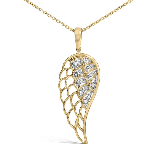 Close-up front view of a yellow metal necklace with an asymmetrical wing-shaped pendant featuring pave-set white gemstones.