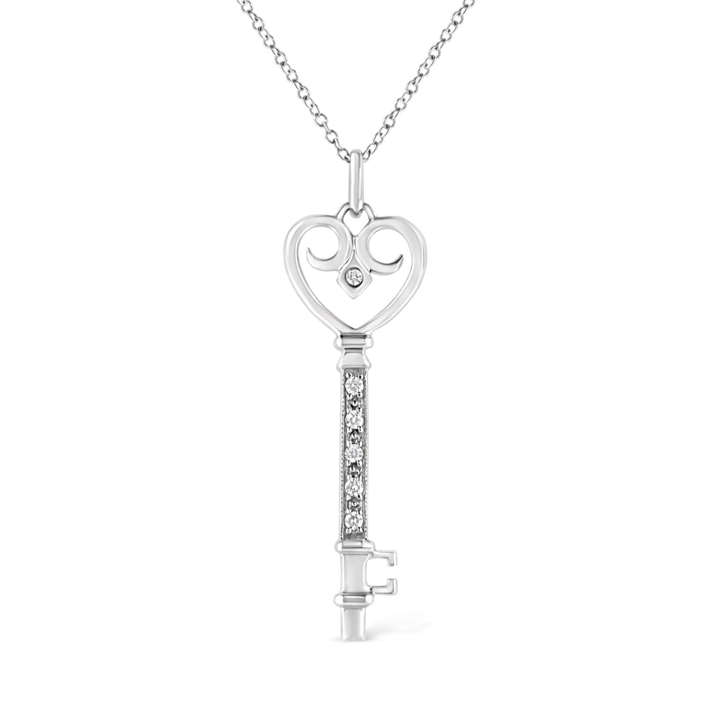 Front view of a white metal key-shaped necklace pendant with a heart-shaped top featuring one round brownish gemstone in bezel setting and a vertical bar adorned with round brownish gemstones in pave setting, hanging from a chain.