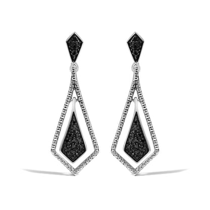 Close-up front view of a pair of white metal earrings featuring geometric shapes with black gemstones in pave settings.