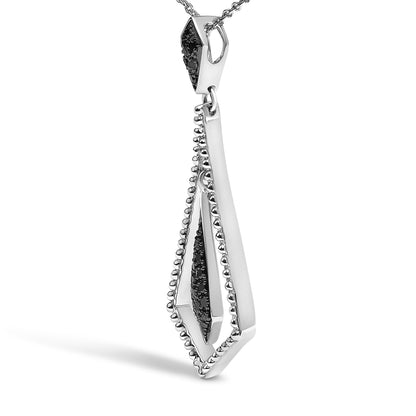 Close-up front angle of a white metal geometric pendant necklace with black round gemstones in a pave setting, shown on a white background.
