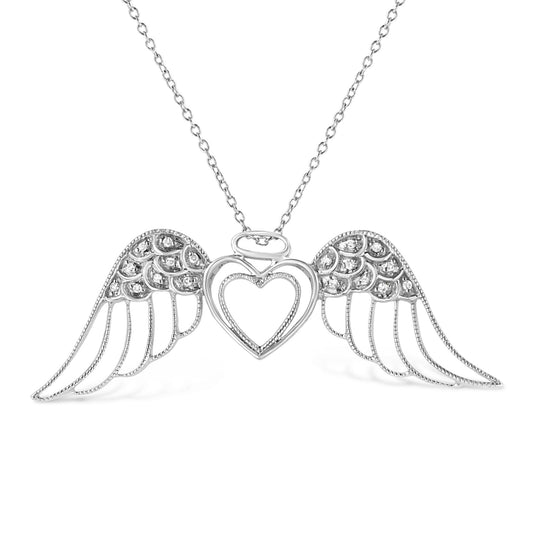 Front-facing shot of a white metal necklace with a heart-shaped pendant flanked by angel wings, each wing adorned with round white gemstones in pave setting.