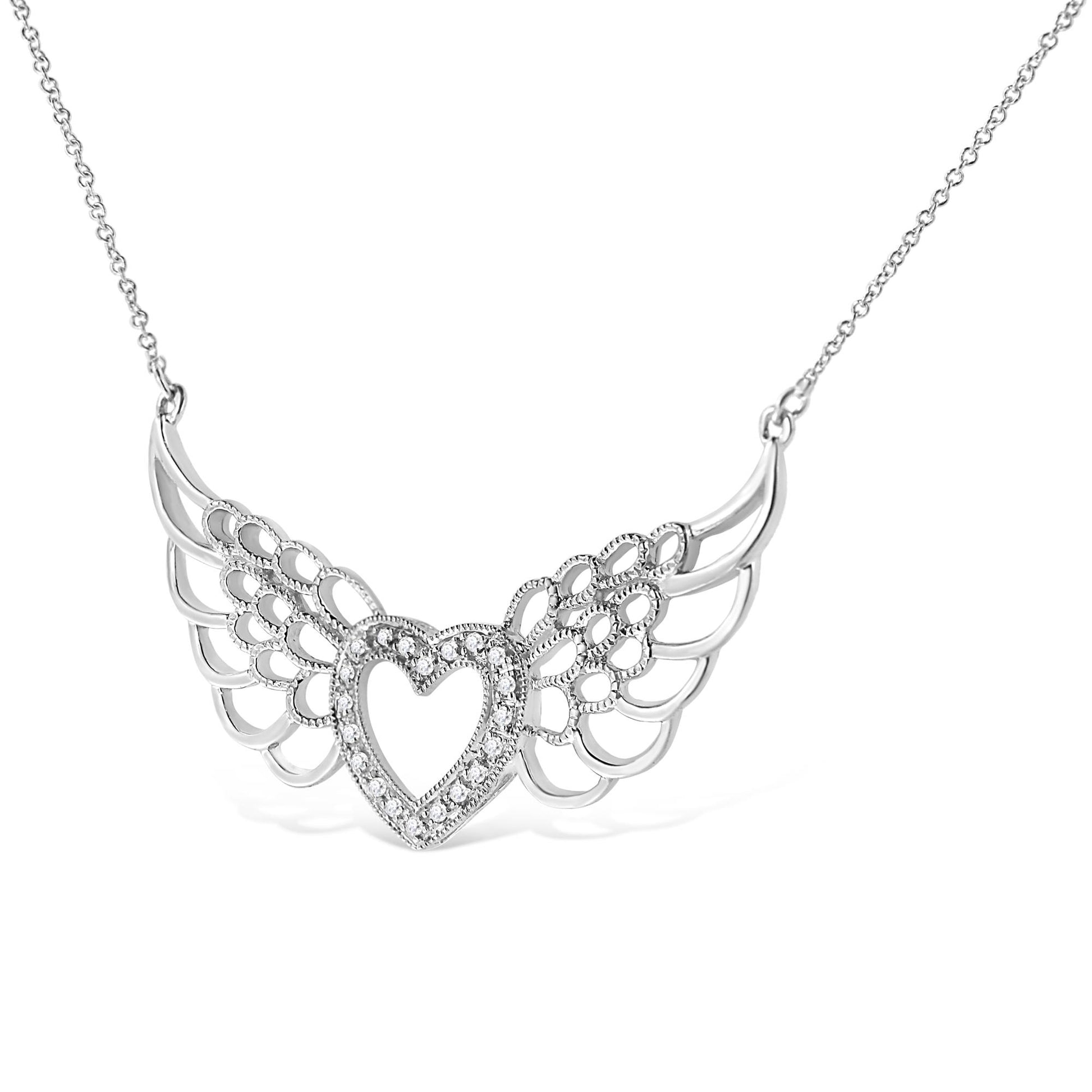 Front angle view of a white metal necklace with a heart-shaped centerpiece surrounded by white round pave-set gemstones and wing-like openwork designs on each side.