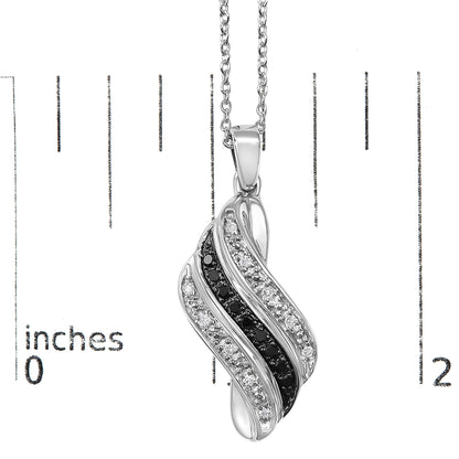 Close-up front view of a white metal necklace pendant with an intertwined design featuring pave set white gemstones and prong set black gemstones, shown on a scale.