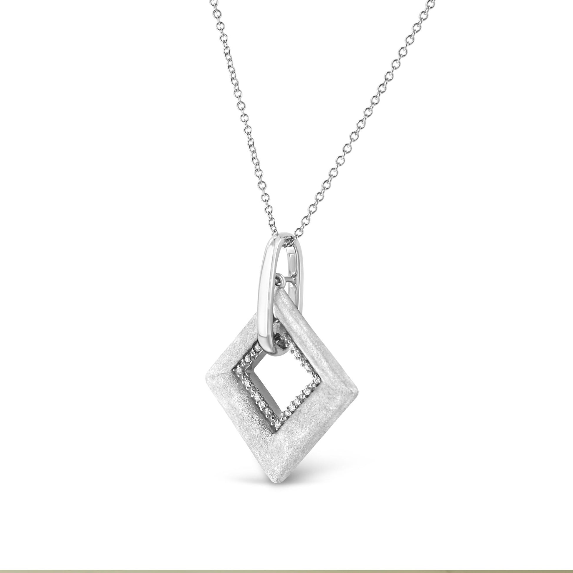 White metal necklace with a geometric pendant featuring a diamond-shaped outer frame and a pave-set inner frame of white gemstones, shown in a front-facing close-up angle.