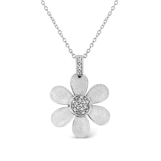 Front view of a white metal necklace with a flower-shaped pendant featuring textured petals and a center adorned with small white gemstones in a pave setting.