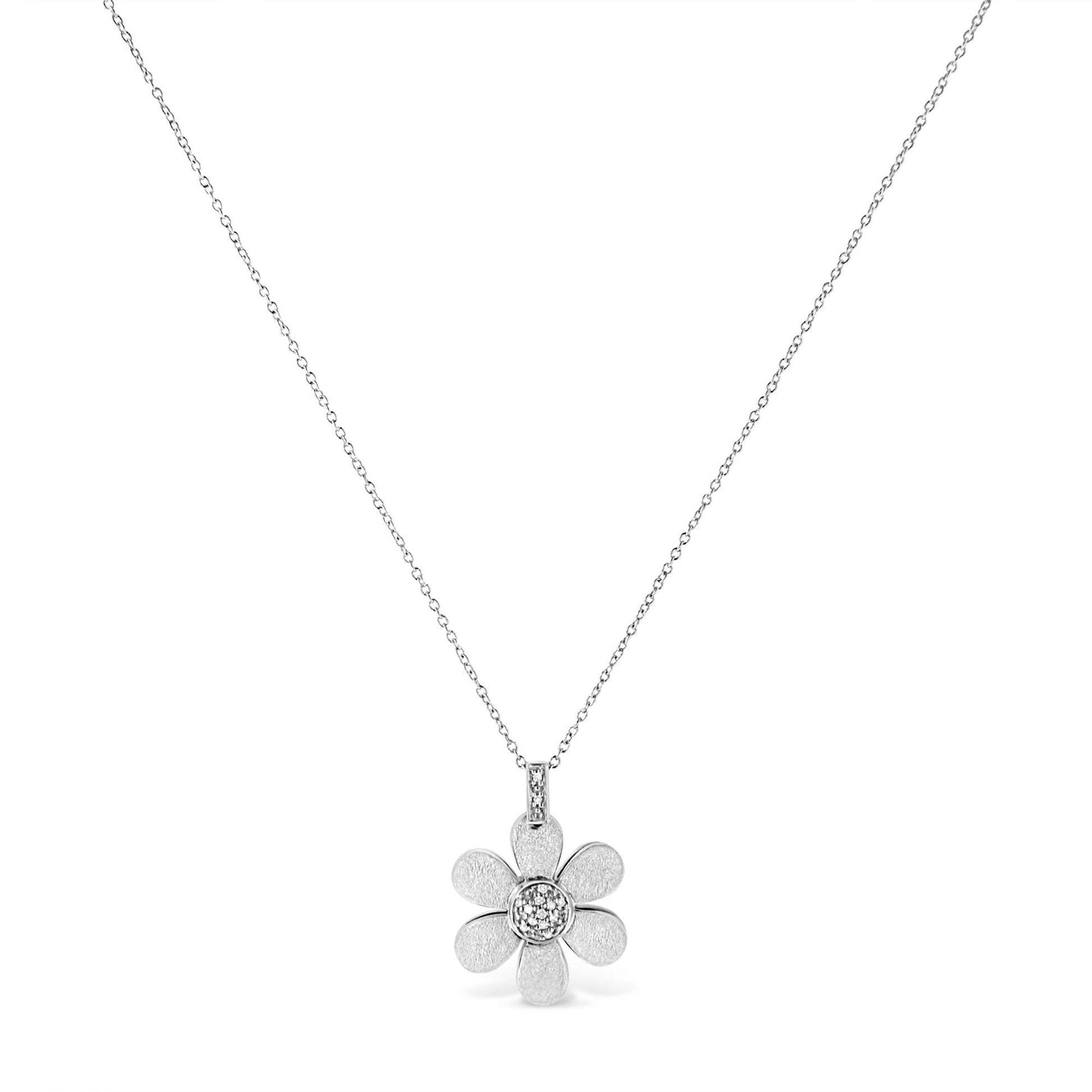 Front view of a white metal necklace with a flower-shaped pendant featuring round white gemstones in pave setting on the chain loop and center.