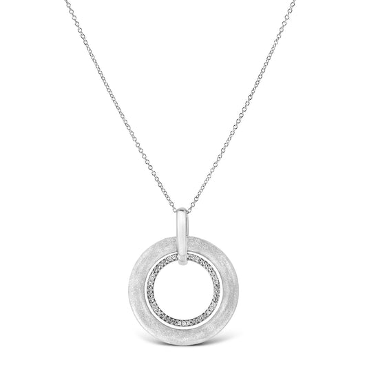 Front view of a white metal necklace with a circular pendant featuring an outer smooth ring and an inner ring set with small round white gemstones.