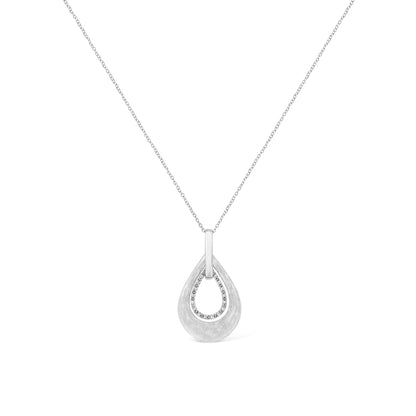 Front view of a white metal teardrop-shaped necklace pendant featuring an inner teardrop outline set with round white gemstones in prong settings.