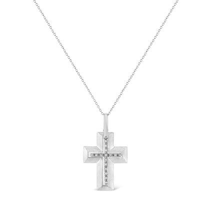 Front-facing shot of a white metal cross necklace with a smaller cross of white round prong-set gemstones in the center, hanging from a delicate white chain.