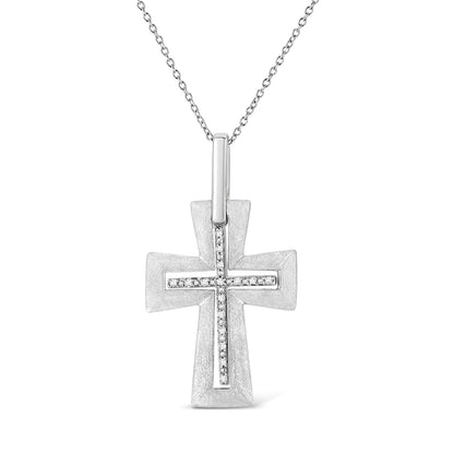 Front-facing view of a white metal cross-shaped necklace pendant with two rows of round white gemstones in prong settings forming a smaller cross on top, hanging from a delicate chain.