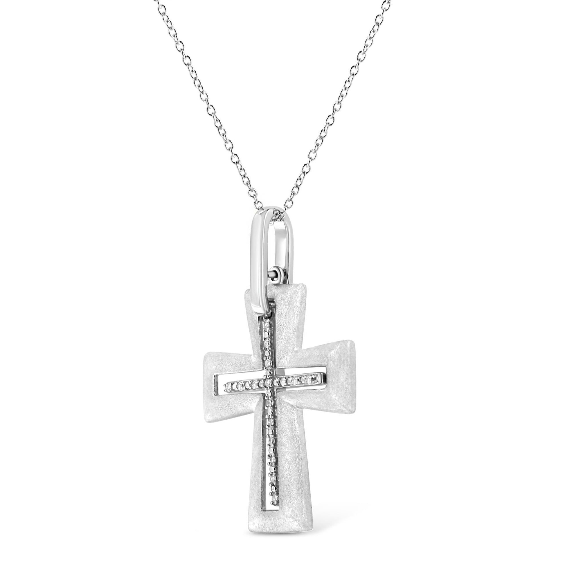 Front facing white metal cross necklace pendant with a line of white round gemstones in prong settings forming a cross shape, shown against a white background.