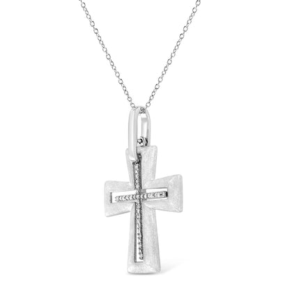 Front facing white metal cross necklace pendant with a line of white round gemstones in prong settings forming a cross shape, shown against a white background.