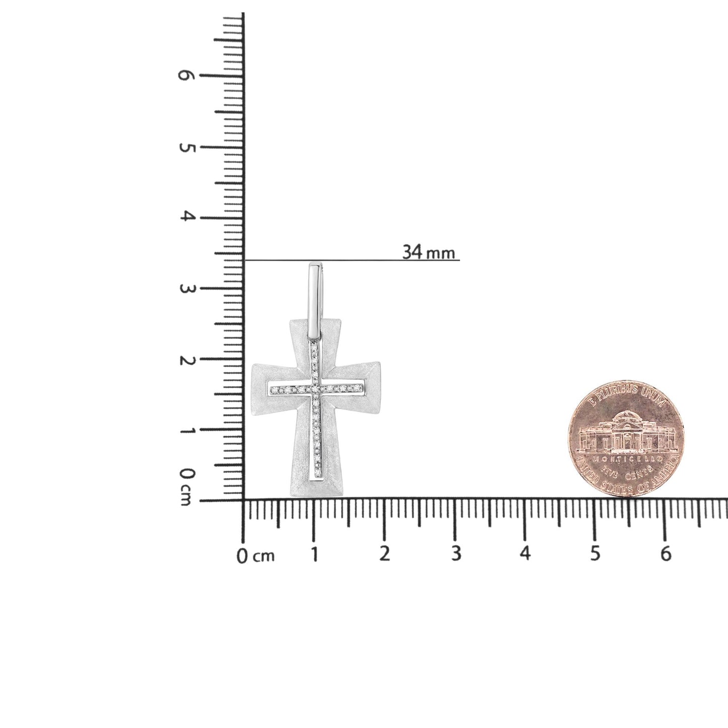 White metal cross-shaped necklace pendant with white round prong-set gemstones in a vertical and horizontal line, shown from the front on a ruler for size reference.