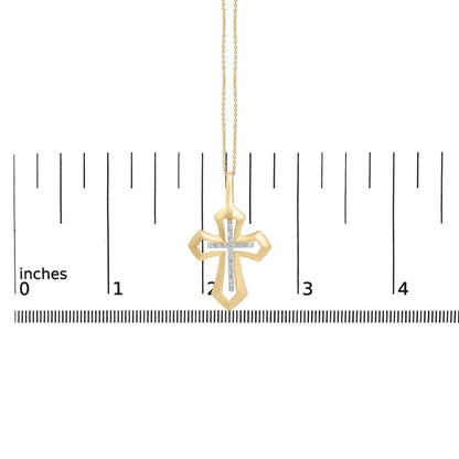 Front view of gold vermeil Roman cross pendant showcasing diamond-accent center and chain on an inch measurement ruler