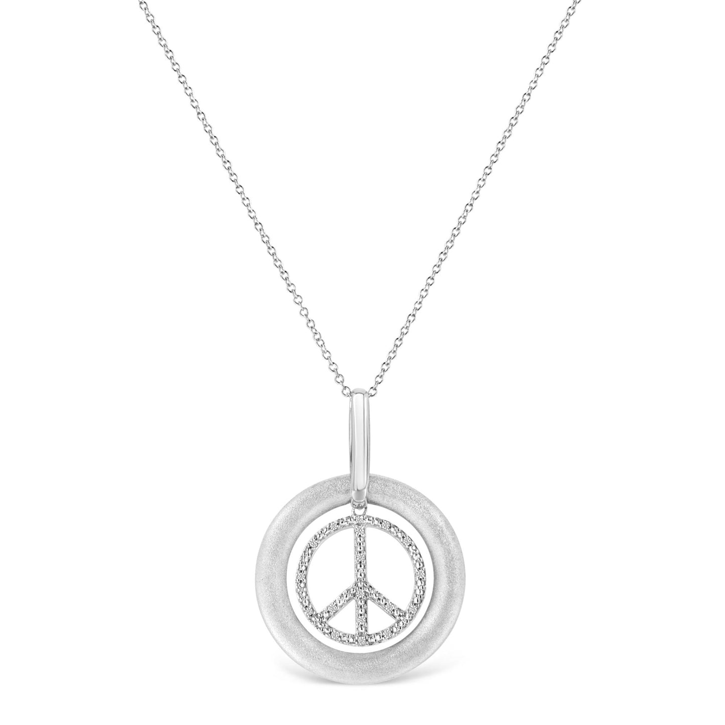 Front-facing shot of a white metal necklace with a pendant featuring a textured circular frame and an inner peace symbol adorned with round white gemstones in prong settings.