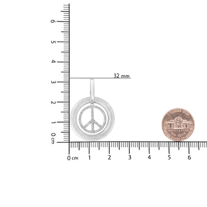 Front angled view of a white metal circular pendant necklace with a peace symbol inset adorned with round white gemstones in prong settings, shown on a ruler and scale for size reference.