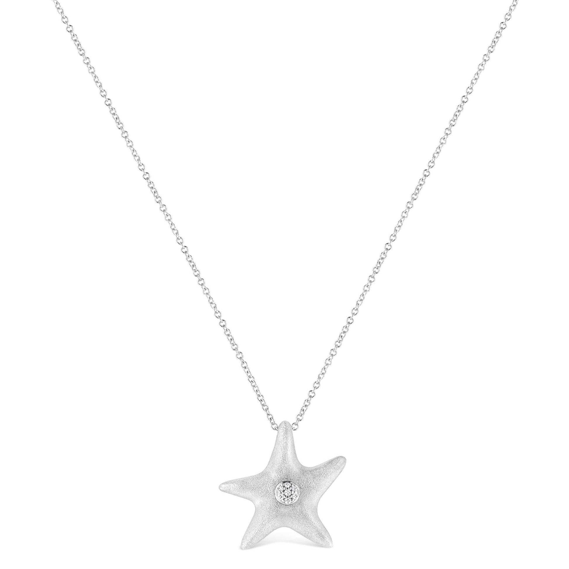 White metal necklace with a star-shaped pendant featuring a round white gemstone set in the center, shown from the front.