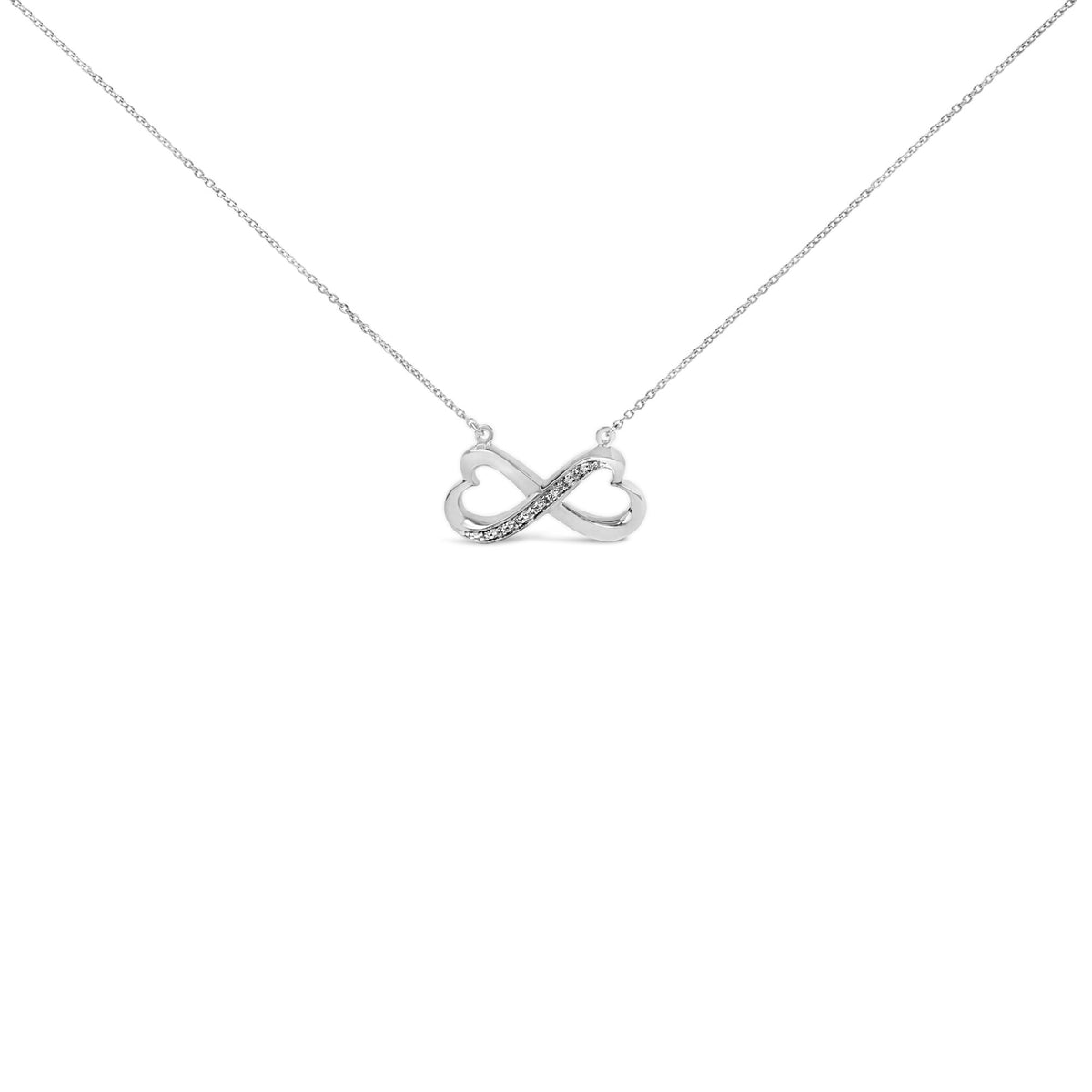 White infinity-shaped necklace with a row of seven round white gemstones in a pave setting on one side, shown from a front angle on a white background.
