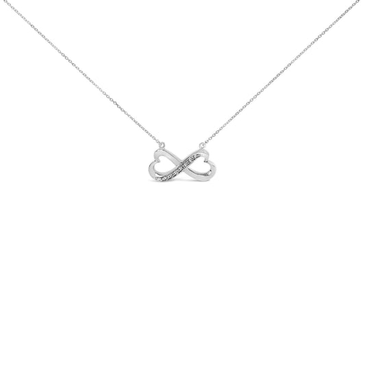 White infinity-shaped necklace with a row of seven round white gemstones in a pave setting on one side, shown from a front angle on a white background.