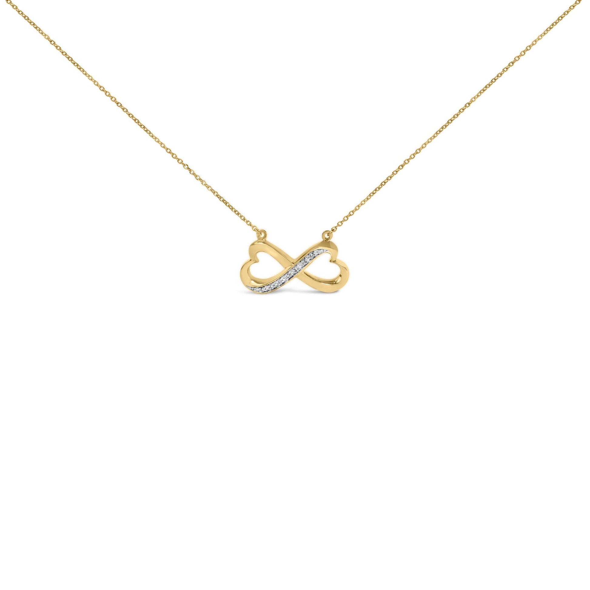 Close-up front view of a yellow necklace with an infinity pendant featuring a diagonal line of white gemstones in pave setting.