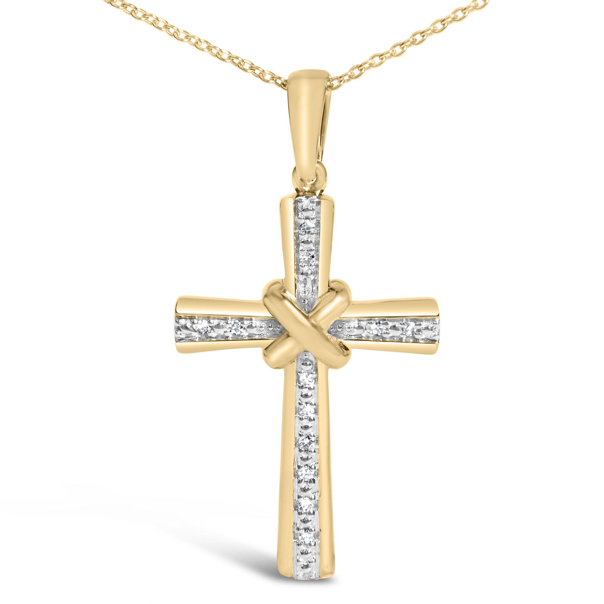 Close-up front view of a yellow metal cross necklace pendant with a knot at the center and white gemstones set in a vertical and horizontal line, shown on a white background.