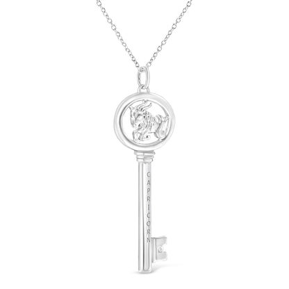 Front-facing shot of a white metal key-shaped necklace pendant with a Capricorn symbol inside the circular top and a small round brownish gemstone in a bezel setting near the bottom.