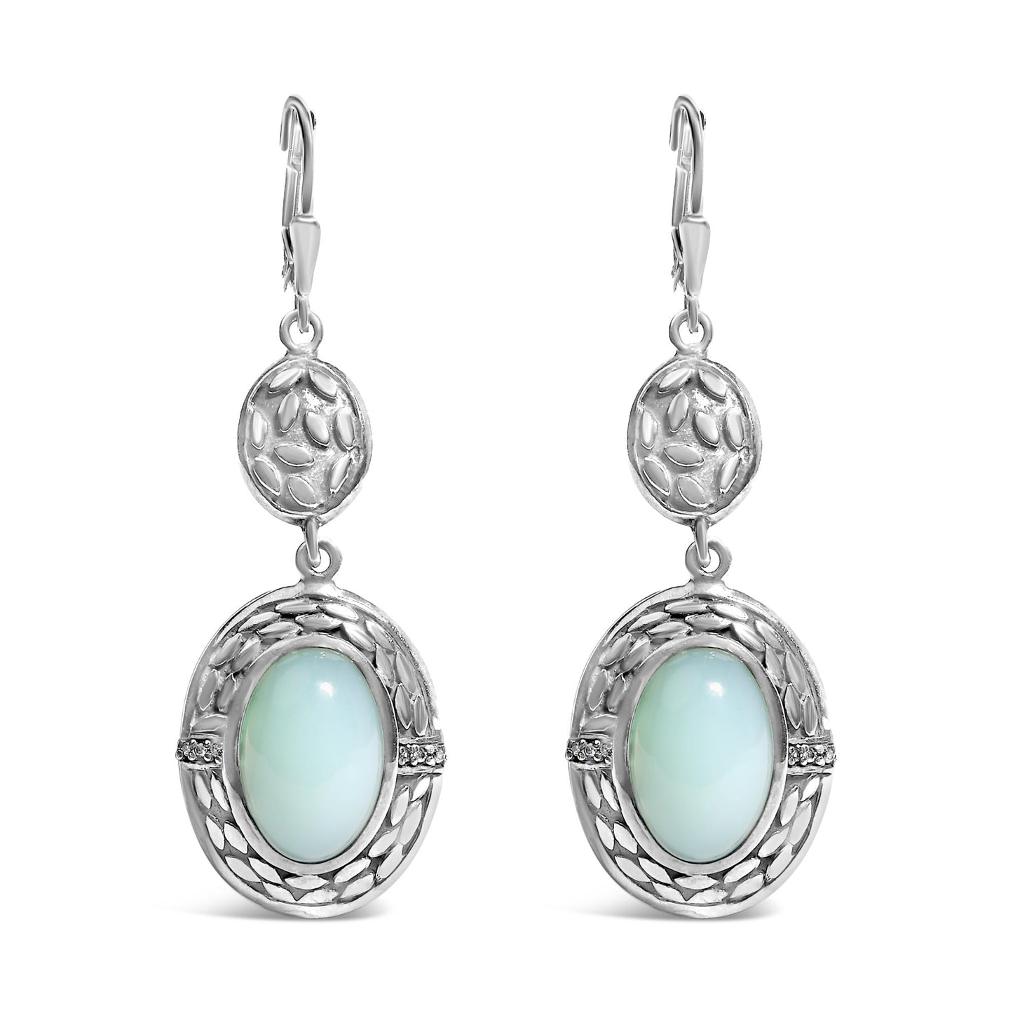 Front view of a pair of white metal dangle earrings featuring an oval gray gemstone in a bezel setting surrounded by decorative detailing and small round white gemstones in prong settings.