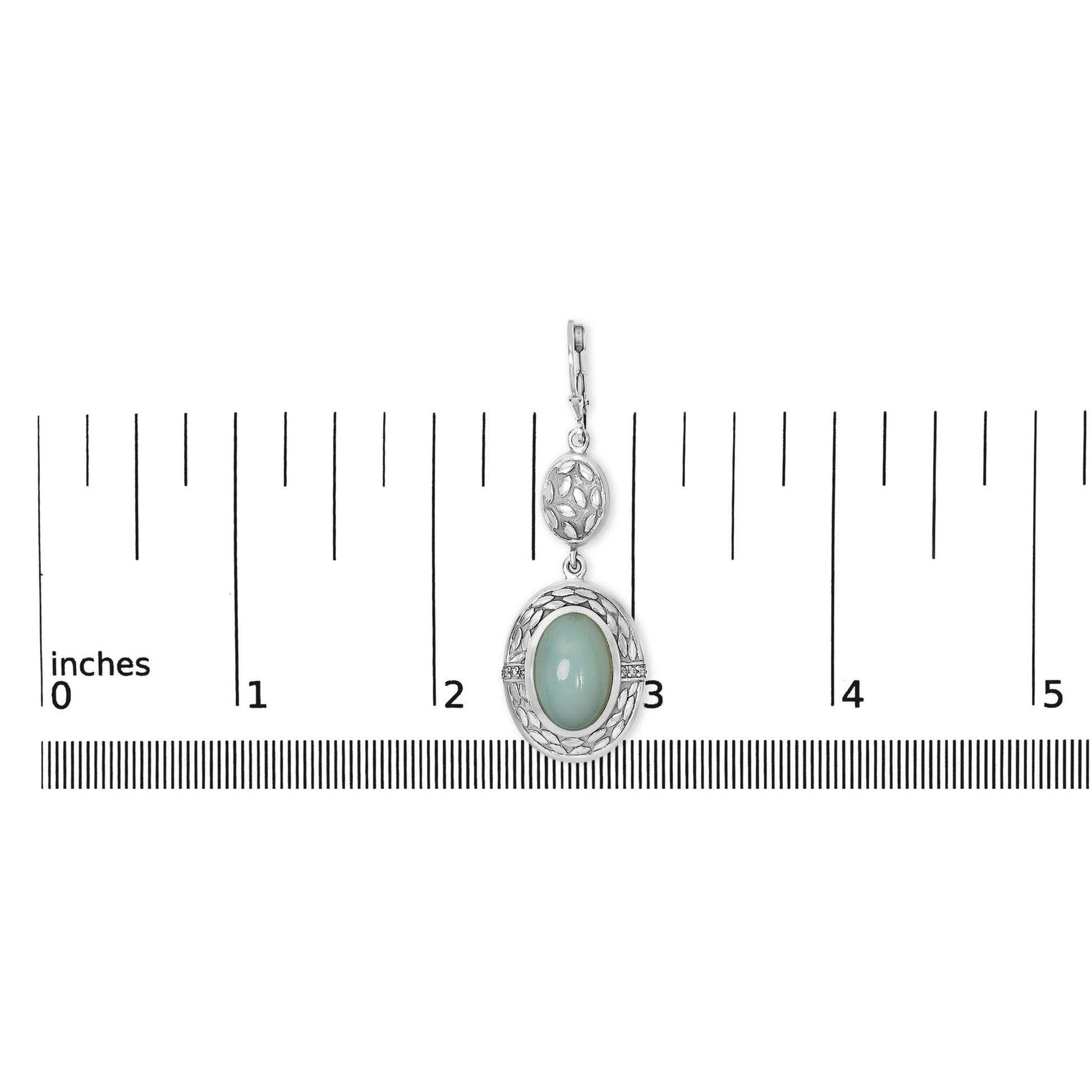 Close-up front view of a single white metal earring shown on a scale, featuring an oval gray gemstone with a bezel setting surrounded by an openwork design and small round white gemstones in a prong setting.