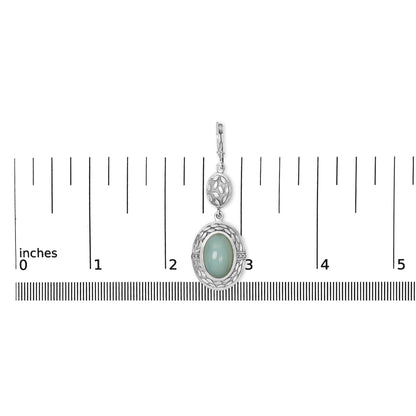 Close-up front view of a single white metal earring shown on a scale, featuring an oval gray gemstone with a bezel setting surrounded by an openwork design and small round white gemstones in a prong setting.