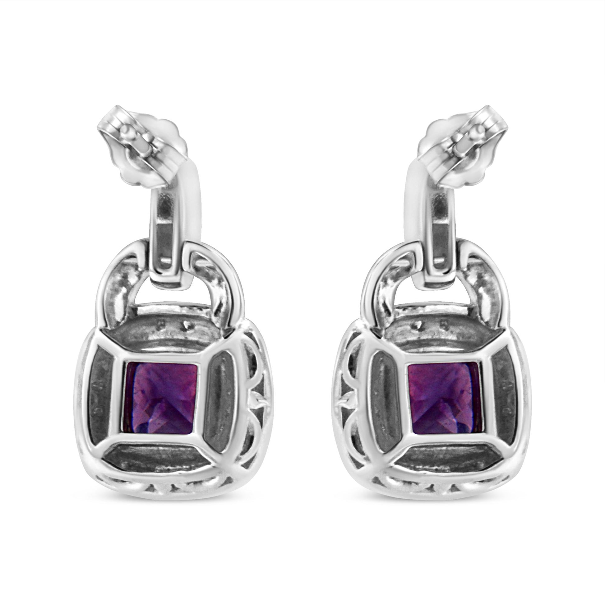 Front view of white metal earrings with cushion-shaped purple gemstones in the center, surrounded by pave-set round white gemstones.