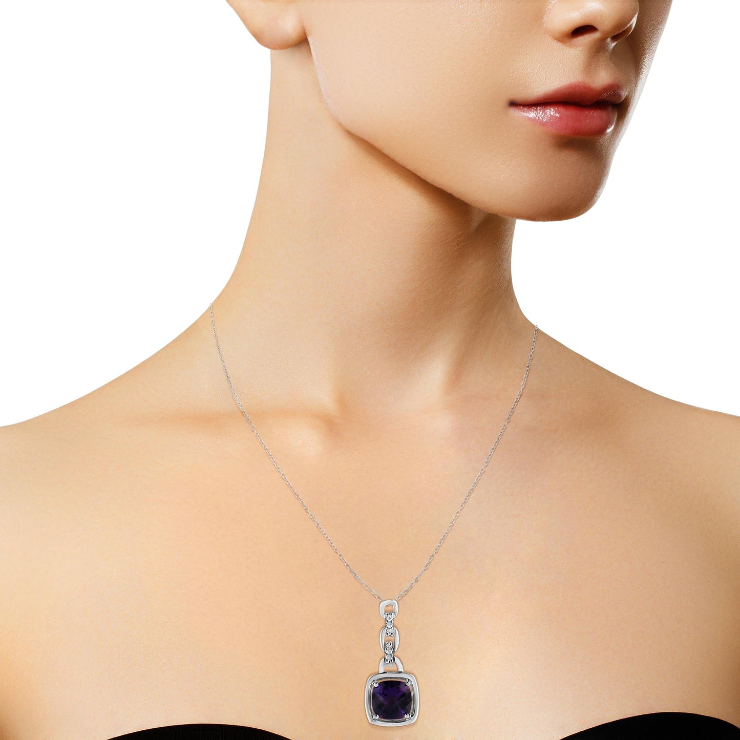 White metal necklace on a model with a pendant featuring a purple cushion-shaped gemstone and small round white gemstones, shot from a front angle.
