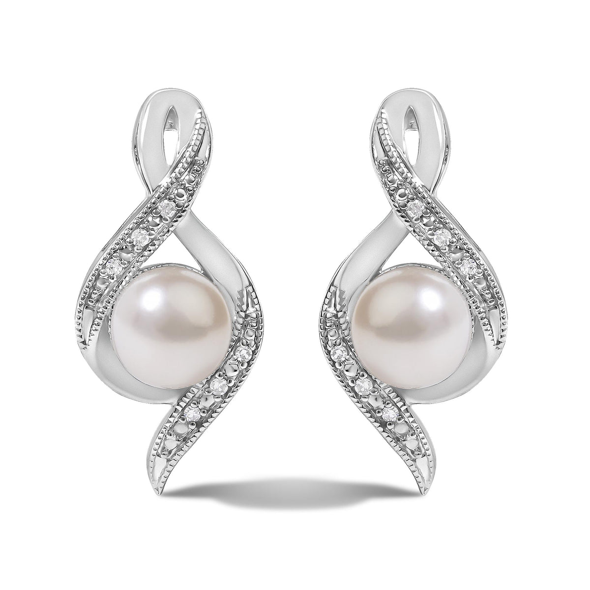 Close-up front view of a pair of white metal earrings with an abstract loop design accented with pave white gemstones and a large round pearl at the base, shown on a white background.