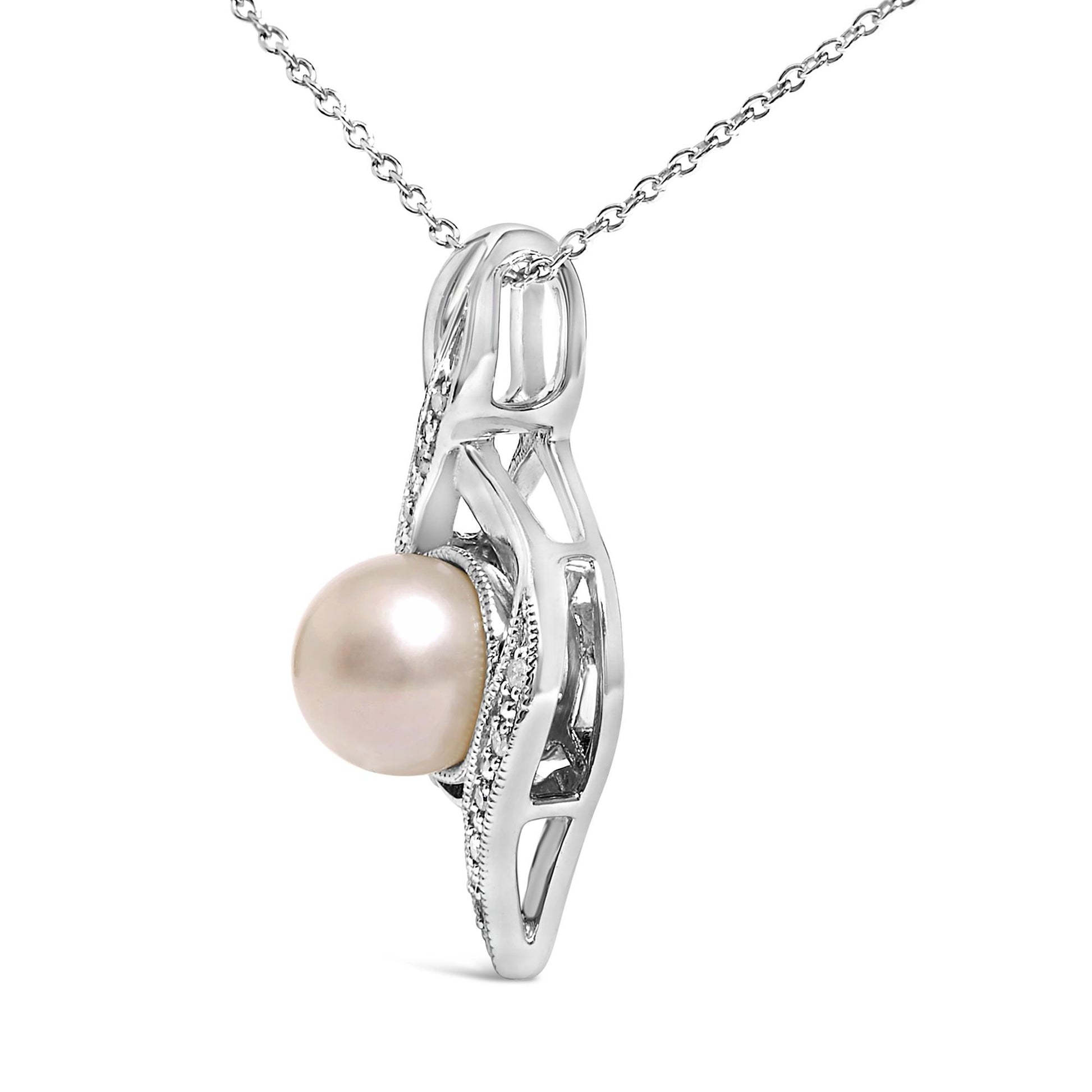Close-up side angle of a white necklace pendant featuring a round central pearl with a surrounding curved design accented by small round white gemstones in a pave setting.