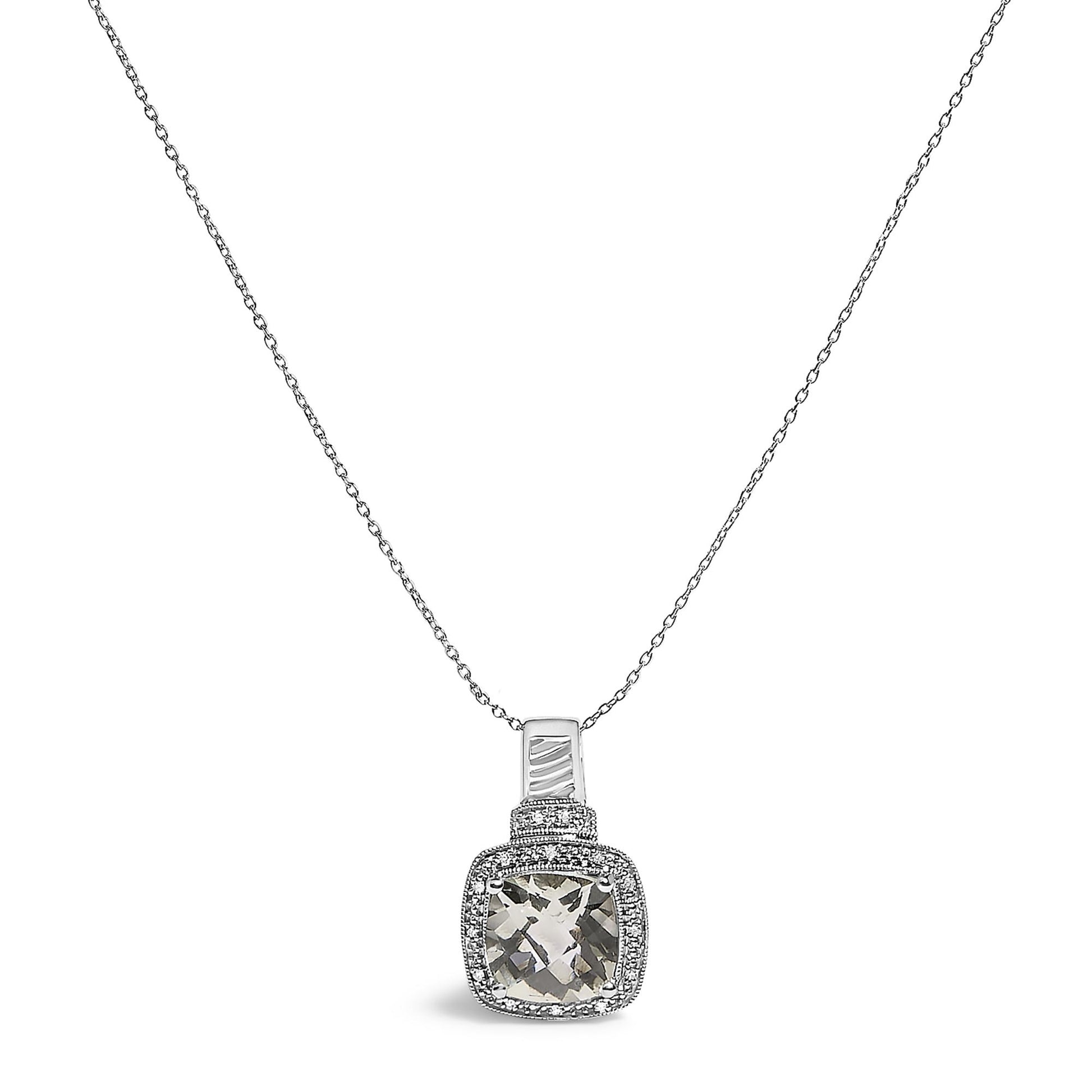 White metal necklace with a cushion-shaped green gemstone pendant surrounded by a pave setting of small white gemstones, shown in a front close-up angle.