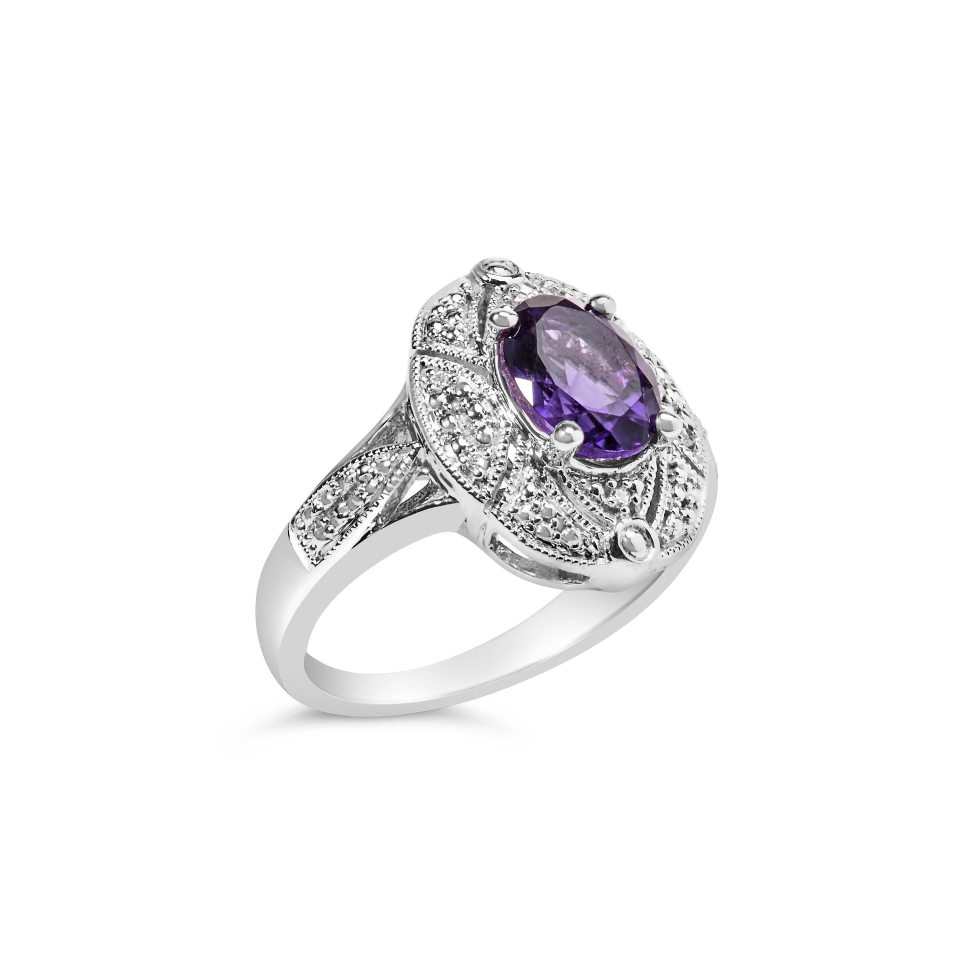 White metal ring with an oval purple gemstone in a four-prong setting, surrounded by round white gemstones in prong settings, shown at a slight angle.